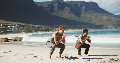 Buy stock photo Fitness, coach and people at beach with yoga, guidance and balance in wellness activity. Calm, squat pose and men at seaside with instructor, zen and mobility improvement in holistic practice.
