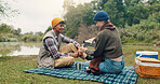 Smile, couple and picnic with coffee outdoor for travel, warm beverage and trekking adventure. Happy, people and camping with drink for breakfast, romance and bonding together on holiday in nature