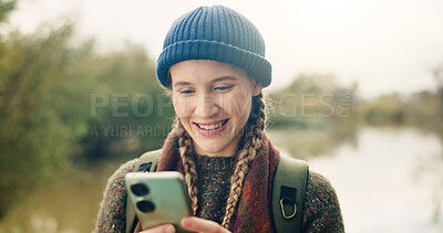 Buy stock photo Cellphone, happy and woman in nature for backpacking with online maps for directions on hike trail. Smile, technology and female person with phone for trekking tips on blog on mobile app in forest.