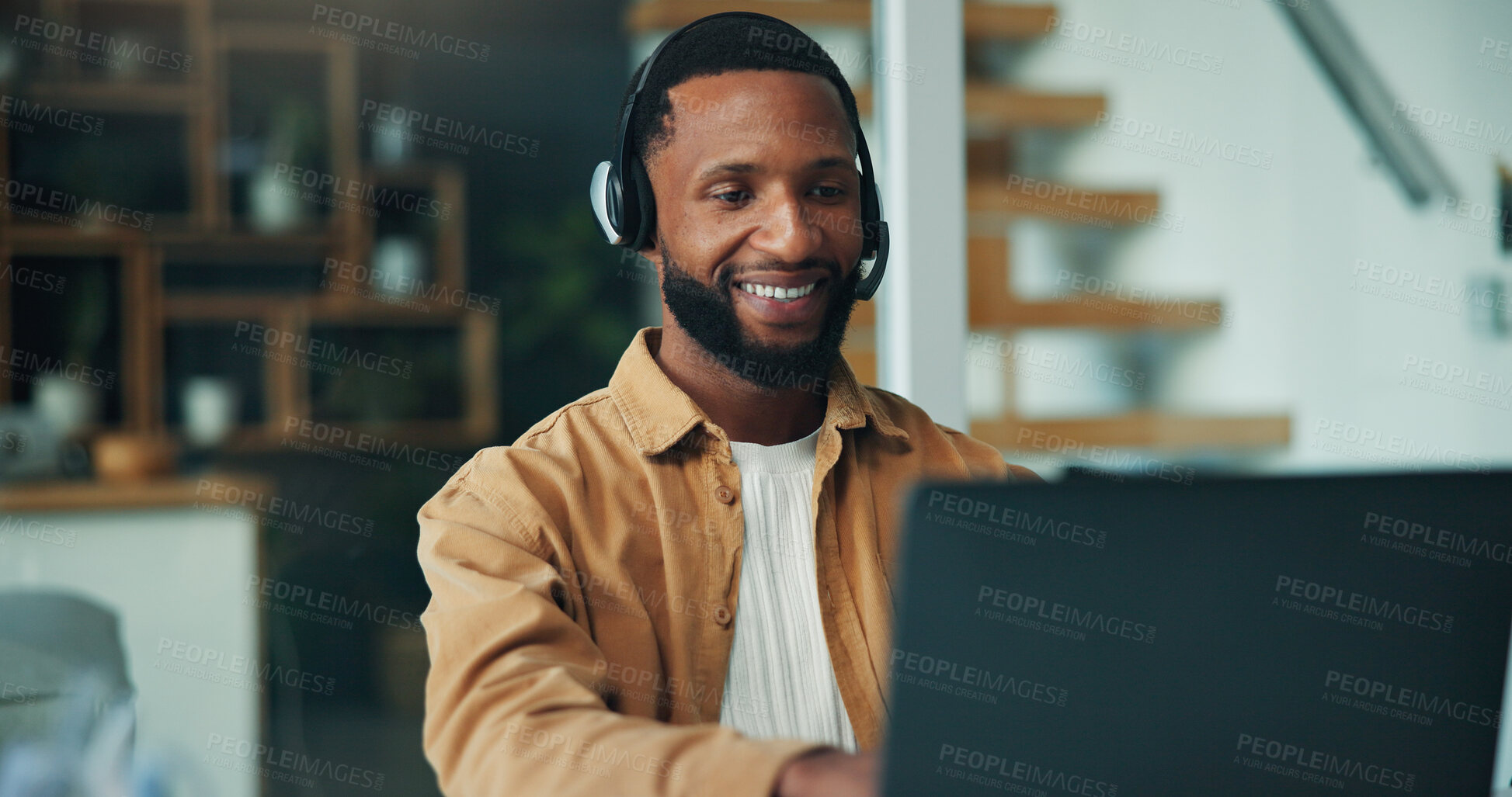 Buy stock photo Black man, laptop and headset with remote work from home, typing and happy for online meeting. Person, computer and virtual assistant with contact, smile and feedback with freelance job at house