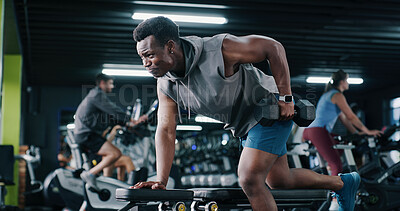Buy stock photo Fitness, bodybuilder or black man in center with dumbbell, endurance or bicep activity in weight training. Exercise, strength or athlete with equipment, intense workout or resilience in muscle gain.