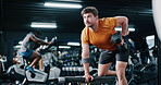 Fitness, man and workout with dumbbell row in gym for muscle development, power and energy. Weightlifting, bodybuilder and person exercise for resistance training, strength improvement and health