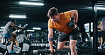 Fitness, man and exercise with dumbbell row in gym for muscle development, power and energy. Weightlifting, bodybuilder and person workout for resistance training, strength improvement and health