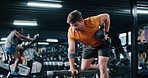 Fitness, man and training with dumbbell row in gym for muscle development, power and energy. Weightlifting, bodybuilder and strong person exercise for resistance workout, wellness challenge or health
