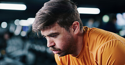 Buy stock photo Breathing, fatigue and man in gym for fitness break, wellness and recovery from intense exercise. Sweat, tired and person in workout club for rest, health and resilience for challenge with bokeh