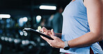 Person, hands and scroll in gym with tablet, workout research and sign up for personal trainer program. Bokeh, woman and digital tech with exercise website, internet and registration for fitness app.