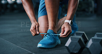 Buy stock photo Person, hands and tying shoes in gym for workout preparation, exercise or indoor training. Closeup, active or runner getting ready with sneakers, laces or dumbbells for fitness in health club
