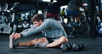 Buy stock photo Man, stretching or gym with leg on floor for workout preparation, exercise or indoor training. Active, male person or getting ready with warm up or dumbbells for flexibility or fitness in health club