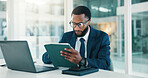 Investor, tablet and black man in workplace, reading and website blog for economy news. African person, app and financial advisor with tech, internet and email notification for stock market exchange