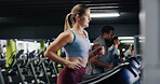 Running, training and woman on treadmill in gym, workout and endurance for fitness with challenge. Cardio machine, health and person in exercise club for sports, energy and practice for wellness