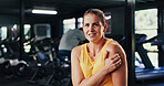 Portrait, woman and discomfort with shoulder pain at gym of fitness injury, muscle fatigue and burnout. Female person, strain and ache from poor warm up, inflammation and tendinitis with joint cramps