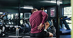 Back pain, emergency and exercise with man in gym for training accident or workout mistake. Fitness, space and spine injury with person in health club for condition, inflammation or muscle fatigue