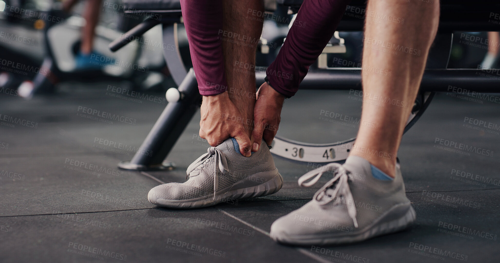 Buy stock photo Fitness, hands and man at gym with ankle pain, injury or accident for workout with inflammation. Osteoporosis, hurt and legs of male person in sports center with muscle bruise  or joint sprain.