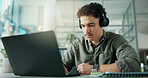 Headphones, laptop and businessman in office with music for creative project with research. Computer, audio tech and male magazine editor with playlist for article with publishing in workplace.