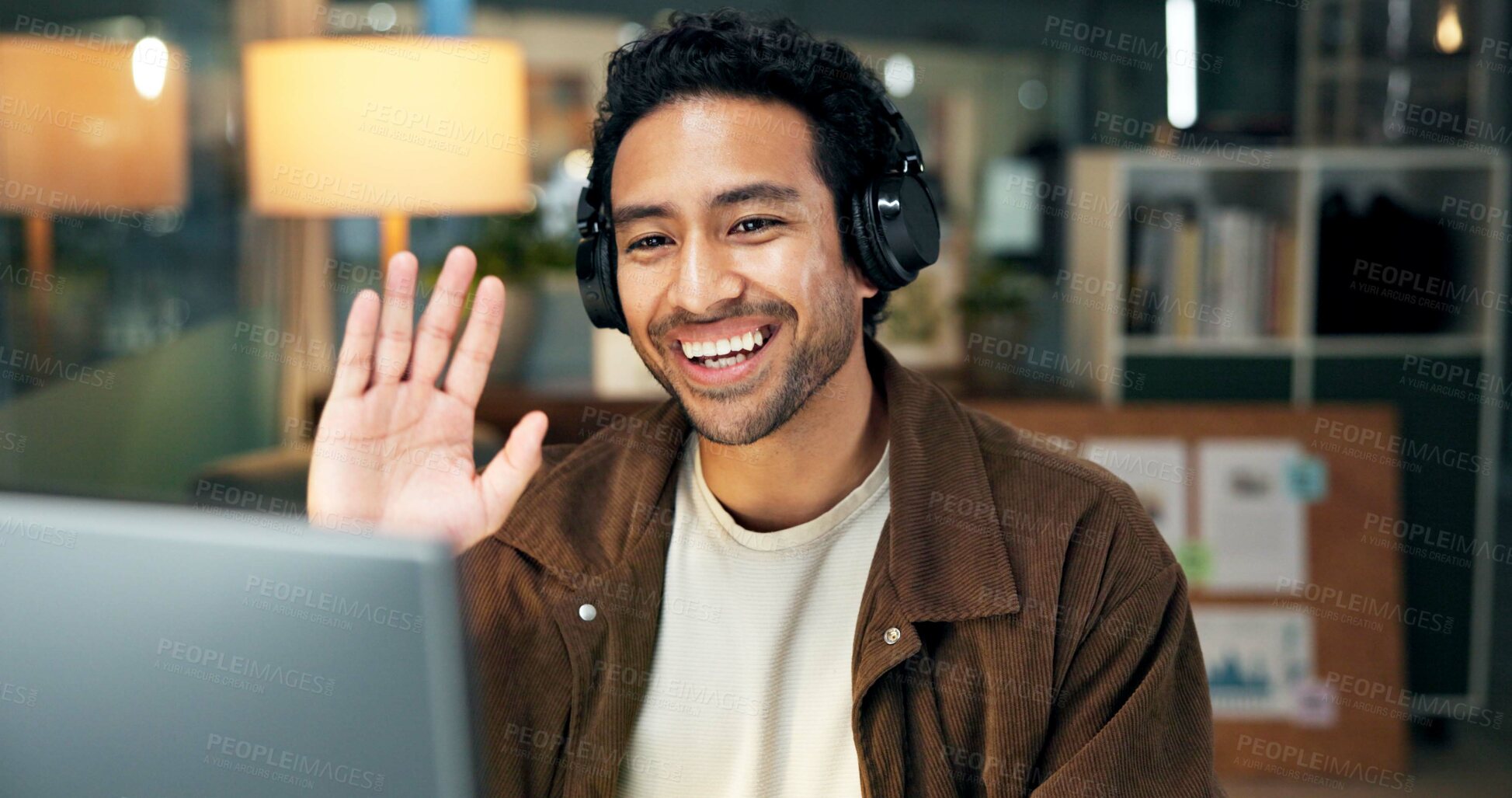 Buy stock photo Night, wave and happy man in office, video call and laptop with headphones, communication and talking. Evening, person or employee in workplace, pc or greeting for online meeting, webinar or feedback