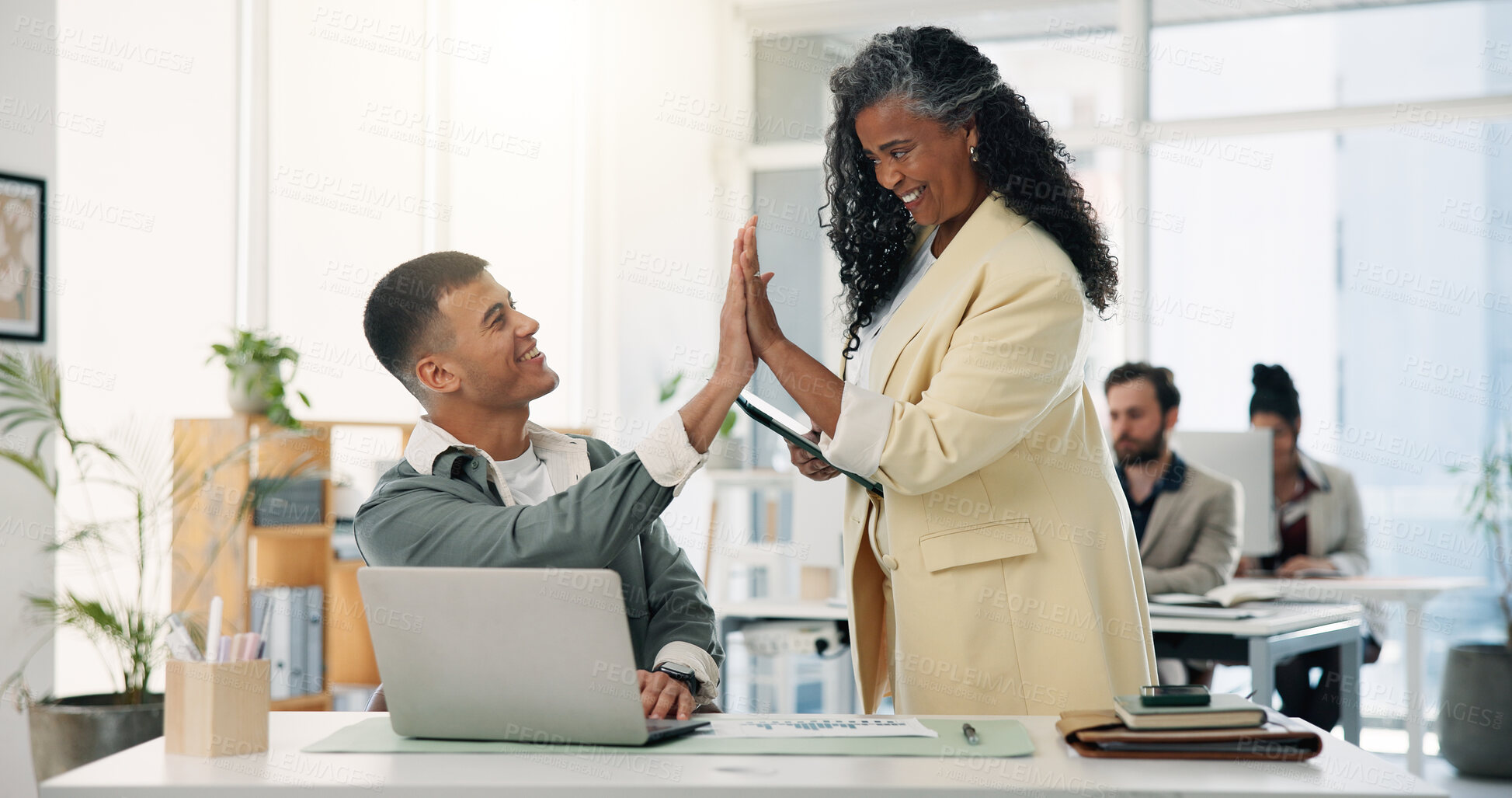 Buy stock photo High five, laptop and success with designer people in office together for bonus or motivation. Computer, congratulations and design with employee team at desk in workplace for goals or target