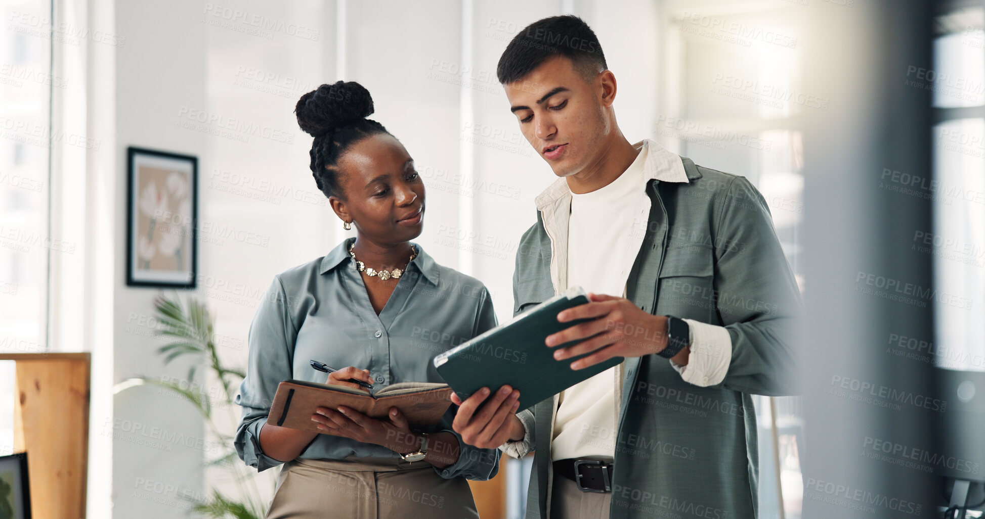 Buy stock photo Woman, man and tablet with notebook, team and discussion with project management at media company. People, talk and tech with app, review and feedback for collaboration at startup creative agency