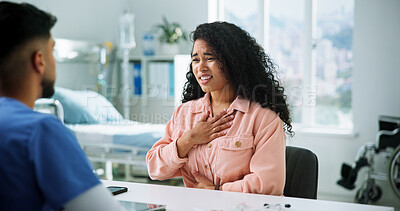 Buy stock photo Consultation, chest pain and woman with doctor in office at hospital for diagnosis, advice or help. Checkup, discussion and female patient with healthcare worker for treatment with sickness in clinic
