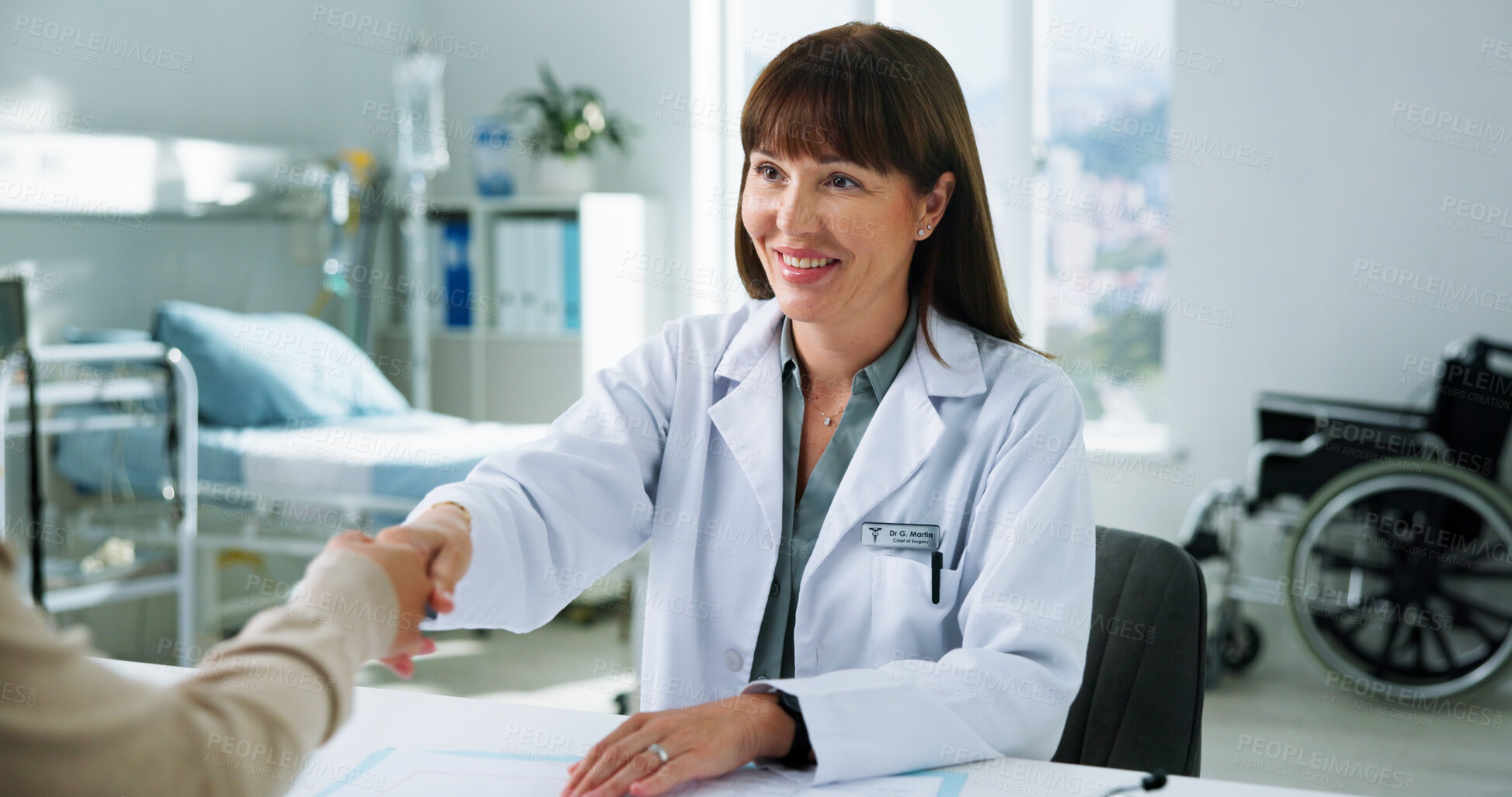 Buy stock photo Woman, doctor and handshake with patient, hospital and thanks for healthcare services in office. People, medical expert and smile for shaking hands in consultation, good news and gratitude at clinic