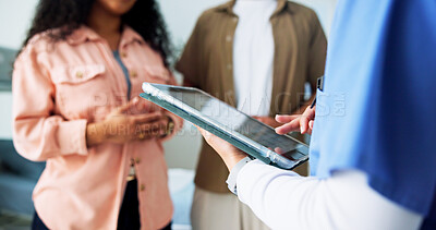 Buy stock photo Couple, consultation and hands with tablet, hospital and test results on website, scroll and online. Clinic, people and medical professional with tech for diagnosis, browsing or patient report on app