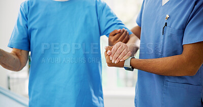 Buy stock photo Hands, physiotherapist and patient with support for walking, help and guide with balance at hospital. People, motivation and healing for recovery, injury or rehabilitation with steps at clinic