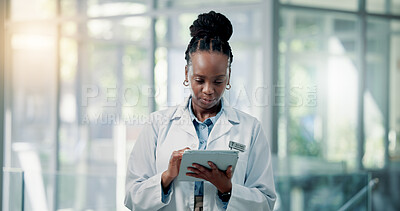 Buy stock photo Doctor, hospital and black woman on tablet for online results, medical research and patient report. Healthcare, clinic and person on digital tech for telehealth website, diagnosis or planning surgery