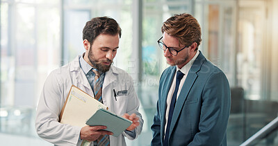 Buy stock photo Doctor, businessman or tablet with discussion in clinic for appeal process, clarify billing info or claim. Health insurance specialist, men and tech in hospital for case management or policy coverage