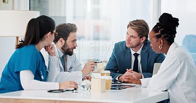 Buy stock photo Businessman, doctors and nurse with meeting in hospital for research grant, vaccine trial or planning. Healthcare, people or staff with update on medical funding, investment opportunity or discussion