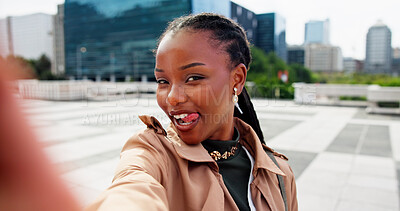 Buy stock photo Black woman, portrait and city with selfie for social media, memory or outdoor photography. Female person, employee or business travel with picture or tongue out for capture moment in an urban town