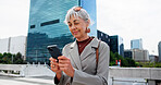 Mature woman, city and typing with phone for network, communication or online research. Female person, business and texting with mobile smartphone for company app or connectivity in an urban town