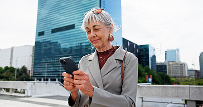 Buy stock photo Mature woman, city and typing with phone for network, communication or online research. Female person, business and texting with mobile smartphone for company app or connectivity in an urban town