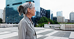 Businesswoman, walk and thinking in city with idea, contemplation and planning for urban development. Mature person, outdoor and reflection downtown for real estate, property investment and insight.