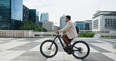 Buy stock photo Business, cycling and travel with man in city carbon neutral or eco friendly transportation. Bike, buildings and commute with employee person riding outdoor in urban town for net zero sustainability