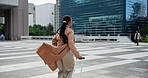 Walking, city or business woman with luggage for stakeholder meeting, travel trip or international client. Urban, back or professional person with suitcase for growth opportunity, overseas or commute