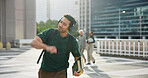 Man, student and dancing with headphones outdoor for good news, exam results and listening to music. Male person, streaming and audio for celebration, university acceptance and rhythm for opportunity