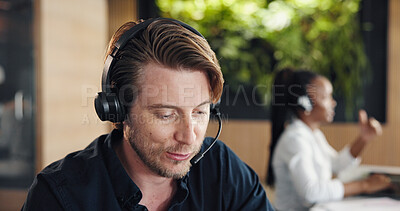 Buy stock photo Call center, talking and man in office with headset, contact us or advice in crm service. Professional, coworking and consultant in agency with tech, online assistance or feedback in client support.