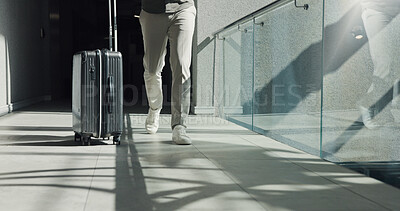 Buy stock photo Business person, legs and walking with suitcase for travel, work commute or job opportunity. Traveler, employee or moving with luggage for company trip, schedule flight or career journey in building