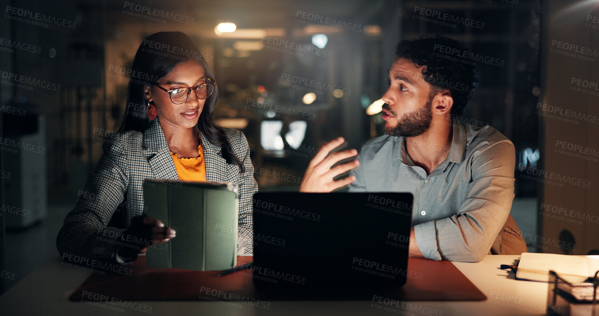 Buy stock photo Tech, discussion and business people in office at night with creative project in collaboration. Feedback, laptop and manager with magazine editors for advice, publishing deadline or article on tablet