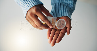 Buy stock photo Hands, pills and person with container of medication in studio for health, wellness or recovery. Pharmaceutical, box and model with capsules for vitamins, tablets or medicine by gray background.