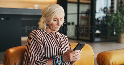 Buy stock photo Woman, relax and reading in home with phone, website and social media app for digital communication. Mature person, browse or typing on sofa with tech, text message or notification for breaking news.