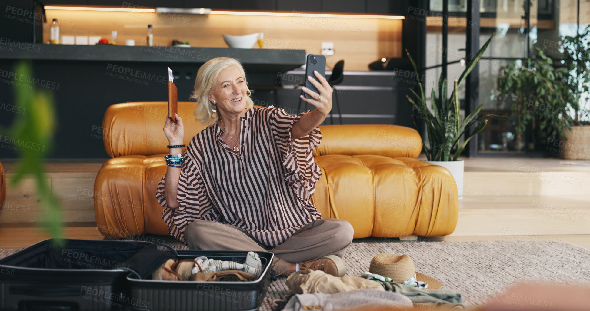 Buy stock photo Mature, happy woman or suitcase with passport for selfie, travel memory or photography in home. Female person, traveler or smile for video with flight ticket for holiday trip or vacation picture