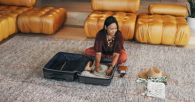 Buy stock photo Mature woman, travel and packing with suitcase for flight booking, holiday or vacation in home. Female person, traveler or getting ready with clothing, luggage or passport for getaway trip in house