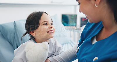 Buy stock photo Happy child, nurse and patient with teddy bear for health checkup, exam or consultation in clinic. Female person, doctor and support care with smile, girl or kid for medical treatment or appointment