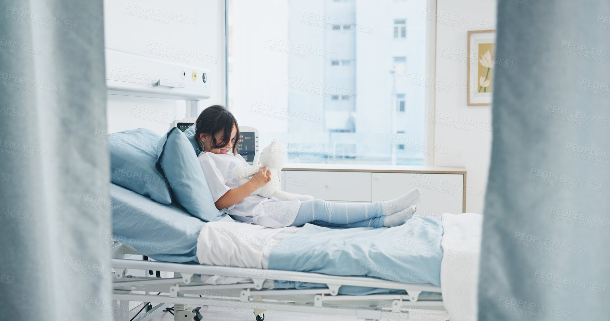 Buy stock photo Teddy bear, healthcare and child in hospital bed with comfort, support or recovery for surgery. Medical, relax and girl kid patient with plush toy for care, healing or wellness in pediatric clinic.