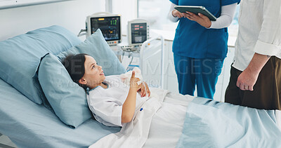 Buy stock photo Happy, child and girl with teddy bear, hospital and nurse with tablet for diagnosis or consultation. Sick, kid and smile on bed with plush toy, dad and discussion with medical professional in clinic