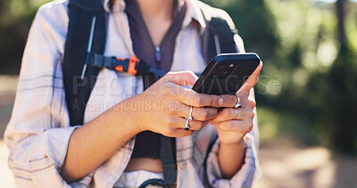 Buy stock photo Hike, chat or hands in forest with phone, message alert or location share in summer hobby. Trekking, network or female person in nature with tech, notification check or journey update on social media