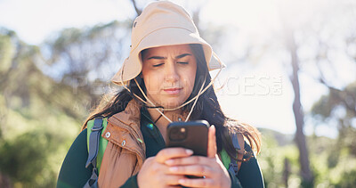 Buy stock photo Phone, navigation and woman in forest for hiking, space and guide in online direction. Travel, bokeh and female person in nature with tech, map tracking and location search on outdoor adventure.
