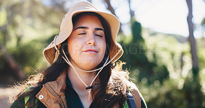 Buy stock photo Woman, happy and thinking with hiking in forest for adventure, inspiration and getaway on holiday. Person, smile and eyes closed in woods for reflection, break and outdoor for trekking in summer