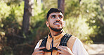 Thinking, man and happy for hiking outdoor with vision, adventure and sightseeing on holiday. Bokeh, person and backpacking with reflection, trekking view and explore nature for vacation in forest