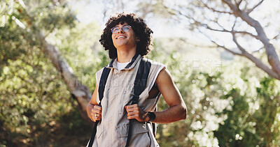 Buy stock photo Thinking, man and hiking for fitness in forest with smile, adventure and sightseeing on holiday. Bokeh, person and backpacking with reflection, trekking view and explore nature on vacation in woods